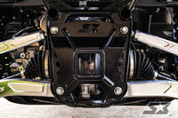 Close-up of a 2019+ Honda Talon suspension and drivetrain featuring the S3 Power Sports HD 2 Hitch Receiver Plate, black ST bracket, axles with rubber boots, metal control arms, and bolts. Clean workshop setting with visible mechanical components.