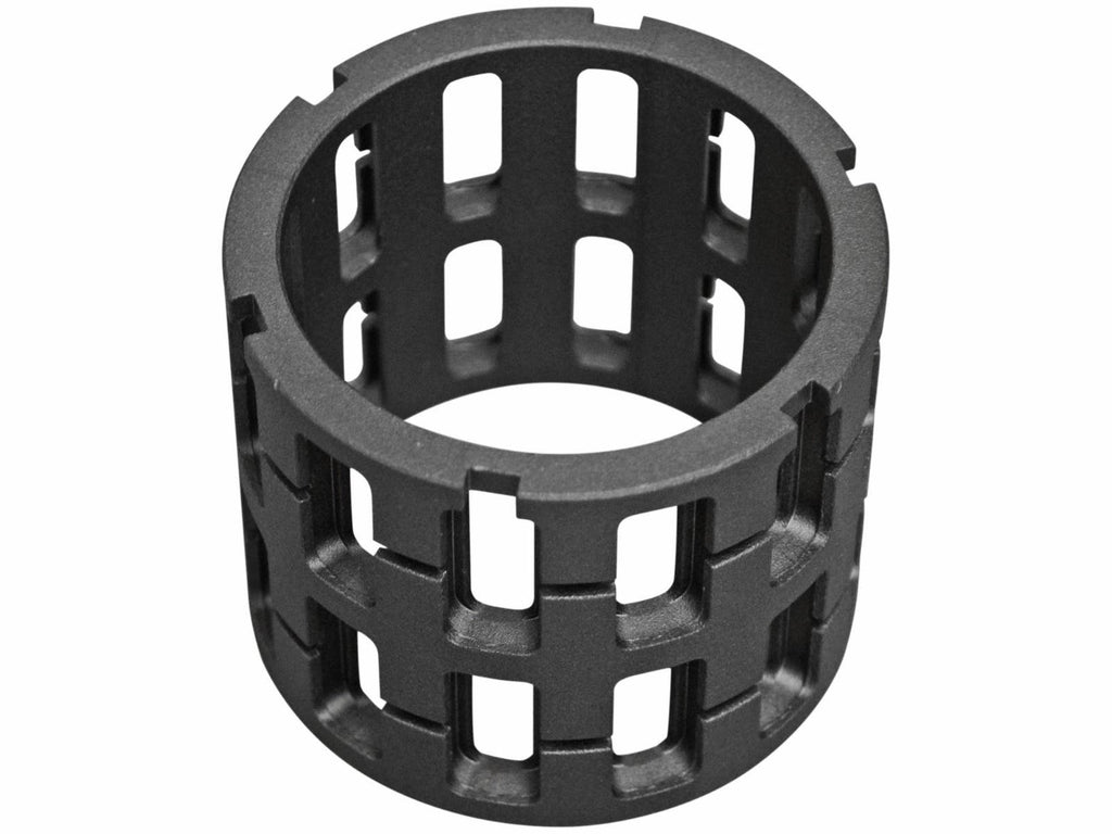 The Polaris RZR XP Turbo Sprague Carrier / Front Roller Cage is a sturdy cylindrical black plastic or metal cage with evenly spaced rectangular cutouts, a grid-like open design, and square-edged notches on each end for an industrial look.