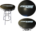 A round black bar table with chrome legs. The tabletop features the white “MOOSE RACING” logo in bold, modern lettering. The image shows the table from the side and from above, emphasizing the logo and shiny, metallic accents.