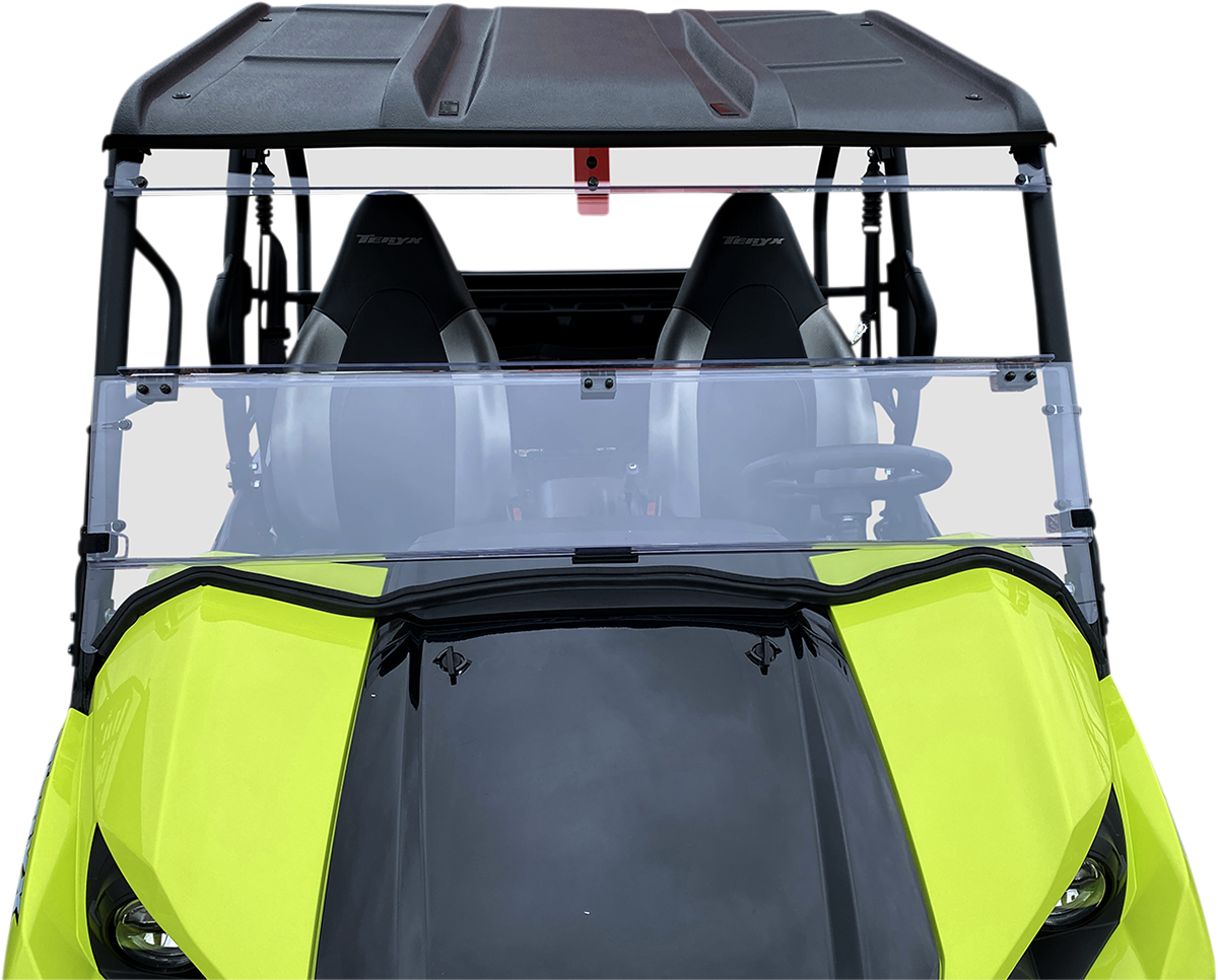 Front view of a bright yellow and black off-road vehicle with two black bucket seats, a clear split windshield, a black roof, and visible roll bars, shown against a white background. The steering wheel and part of the dashboard are visible inside.