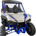 A blue and white Honda off-road utility vehicle with rugged tires, front grill, twin seats, roll cage, and suspension coils, viewed from a front angle against a plain white background.