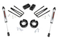 The 3.5 Inch Lift Kit | V2 for Chevy/GMC 1500 (07-13) includes two silver shock absorbers, four black U-bolts, two rectangular lift blocks, two round spacers, and assorted hardware—all displayed on a white background.