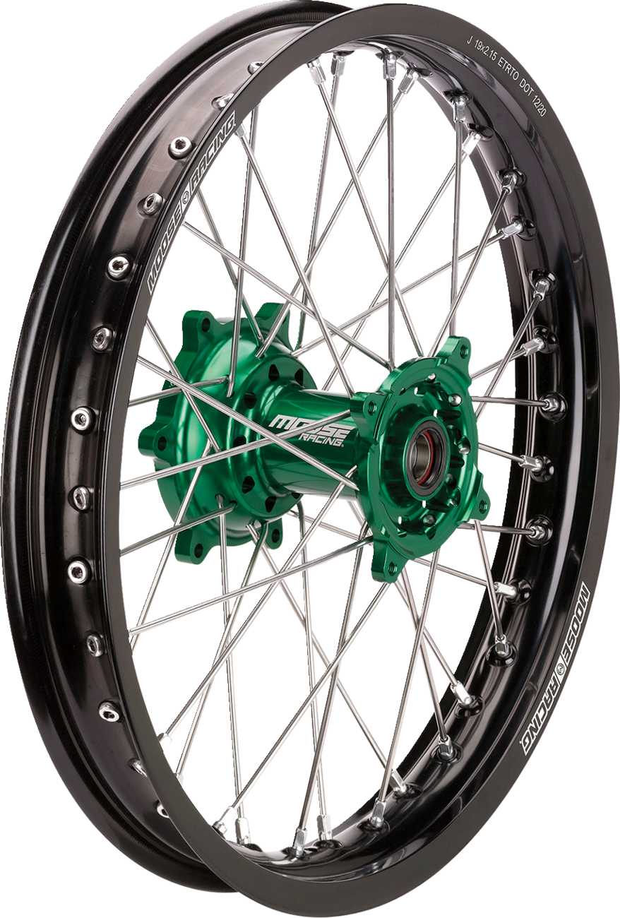 A motorcycle wheel with a black rim, metallic silver spokes, and a green central hub. The rim displays MOOSE RACING branding in white text. The spokes are symmetrically arranged and the wheel is photographed against a white background.