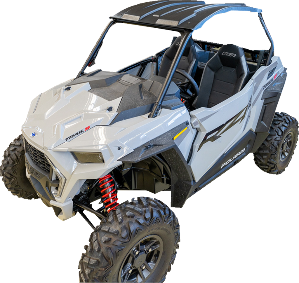 A white, open-cabin off-road Polaris RZR vehicle with large rugged tires, visible red coil suspension springs, a black roof, and two seats. The body has angular lines and Polaris and RZR logos on the side.