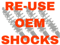 Three grayscale, partially transparent shock absorbers appear in the background. Over them, bold red text reads: RE-USE OEM SHOCKS. Promotes the 2016+ Can-Am Defender Long Travel - OEM Shock Relocation Kit.