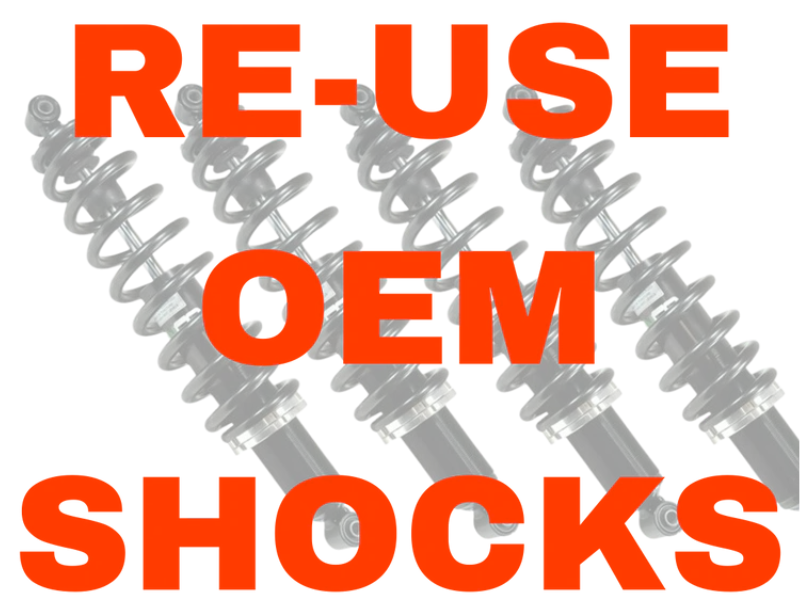 Three grayscale, partially transparent shock absorbers appear in the background. Over them, bold red text reads: RE-USE OEM SHOCKS. Promotes the 2016+ Can-Am Defender Long Travel - OEM Shock Relocation Kit.