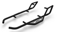 Shown are two black 2017+ Can-Am Maverick X3 Nerf Rails (2 Seat) featuring rugged, angular designs. One includes a silver plate with cutout holes and logo; the other does not. Both have bent tubing and welded support bars.