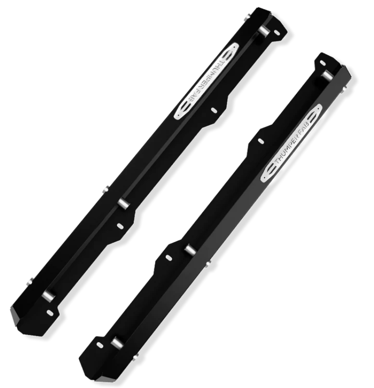 Two black metal Nerf Rails for the 2018+ Tracker 800SX 3 Seat are shown parallel, each with angular edges, silver bolts, and a silver plate engraved with “THUNDERBARS.” The background is plain white.