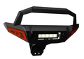 The 2016+ Polaris General Front Winch Bumper (w/ Lights, Black) features a sturdy black metal build, angular design, orange side accents, central LED light bar, raised protective top bar, and bottom mounting holes for easy vehicle attachment.