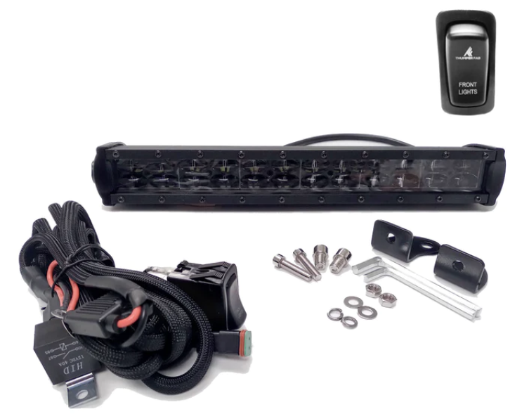 The Front Light Kit - Can-Am Defender, including a black LED light bar, wiring harness, mounting brackets, screws, washers, Allen keys, and a black front lights switch, is displayed neatly on a white background for easy installation.