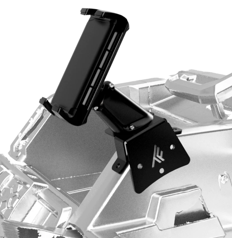 A 2017+ Can-Am Defender Wireless Phone Charger Dash Mount with an adjustable holder and TF logo is screw-mounted to a vehicle dashboard, offering stable hands-free device placement. The setup features a metallic, minimal background.