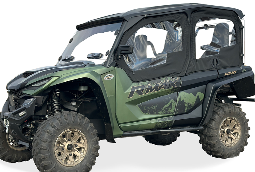 A Yamaha Wolverine RMAX-4 Framed Upper Door Kit, shown on a green and black off-road vehicle with large rugged tires, bronze rims, clear cab windows, and mountain-themed RMAX graphics on the side against a white background.
