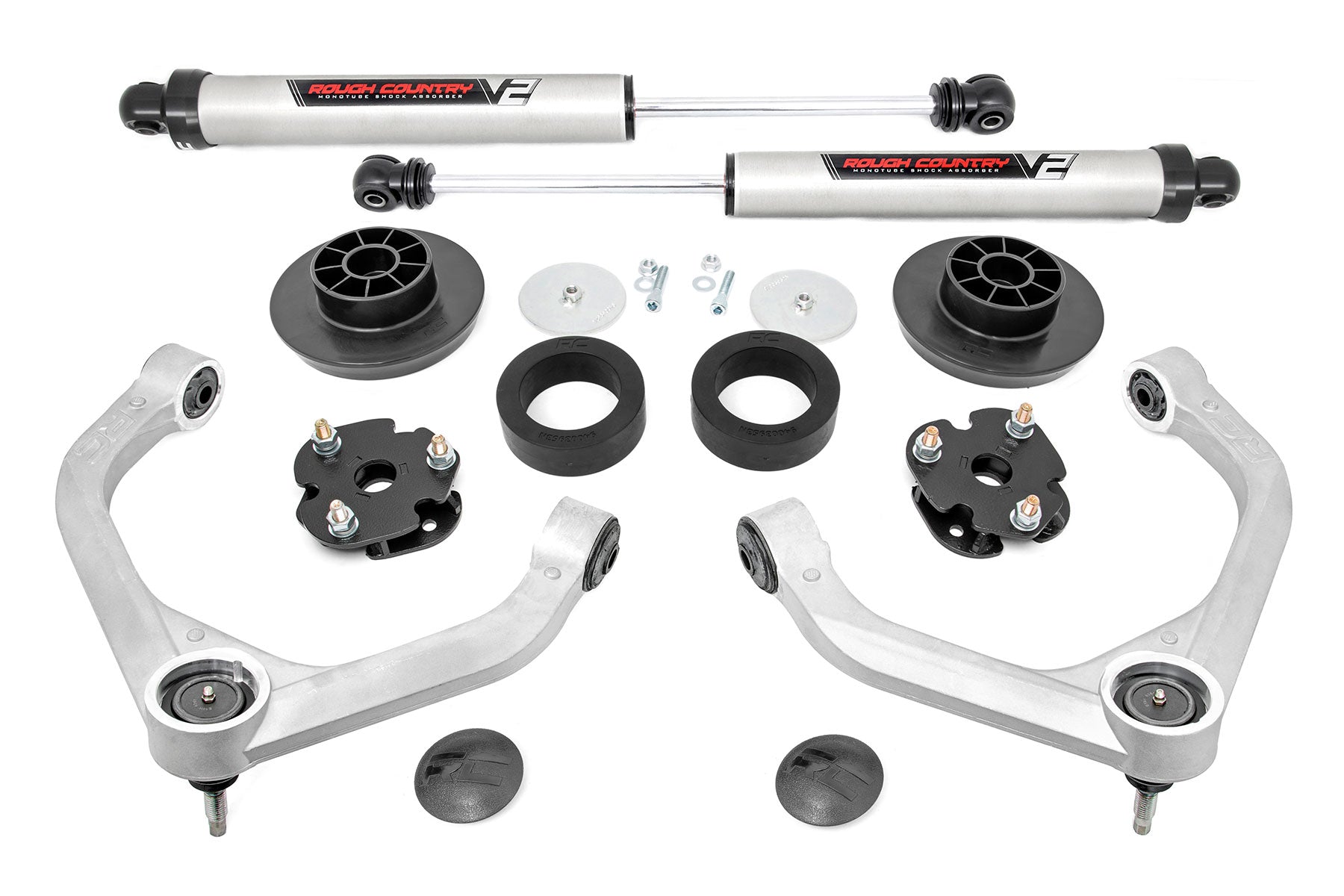 The 3 Inch Lift Kit | V2 for Ram 1500 4WD (2012-2018 & Classic) is displayed on a white background with two silver shock absorbers, two control arms, coil and strut spacers, mounting hardware, and black plastic or rubber components.