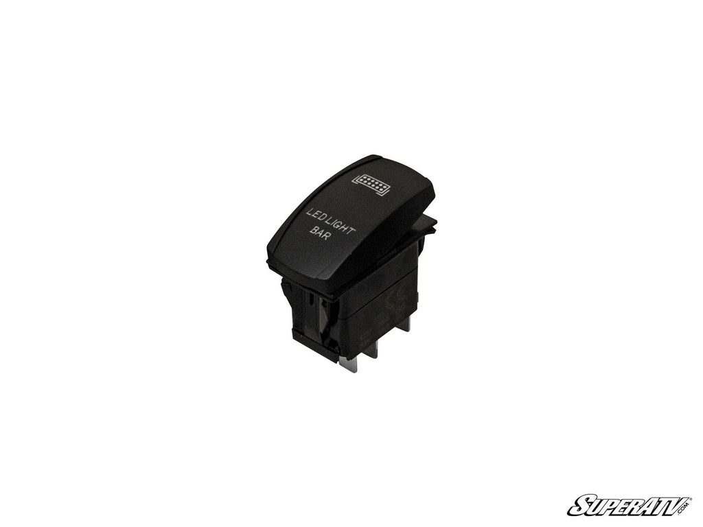A black rectangular 12V / 20A Off-Road Rocker Switch labeled LED LIGHT BAR with a light bar icon above the text, set on a white background. The SuperATV logo appears in stylized black text in the bottom right corner.