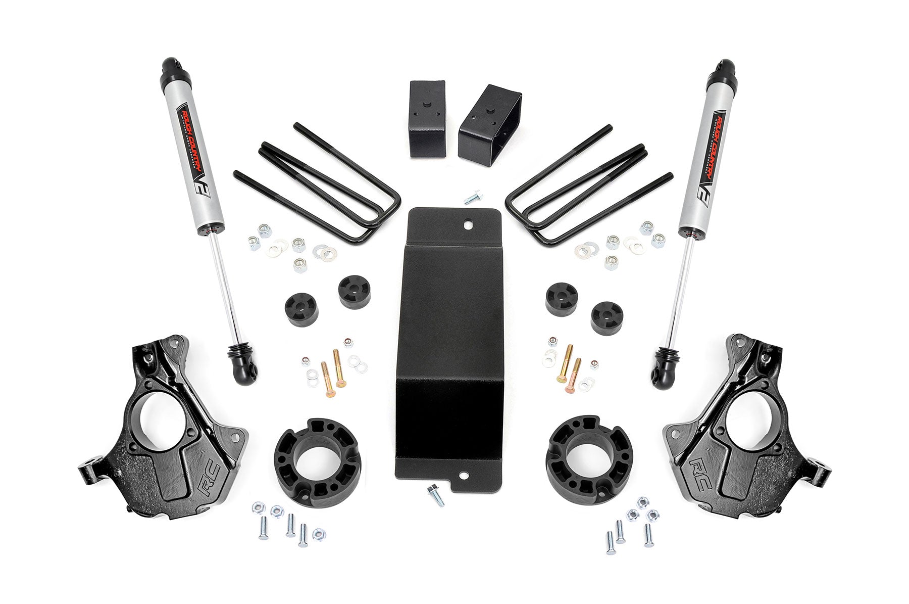 The 3.5 Inch Lift Kit | Cast Steel LCA | V2 for Chevy/GMC 1500 (14-18) is shown laid out on a white background, including shock absorbers, black knuckles, U-bolts, spacers, blocks, bolts, washers, nuts, and a central metal plate.
