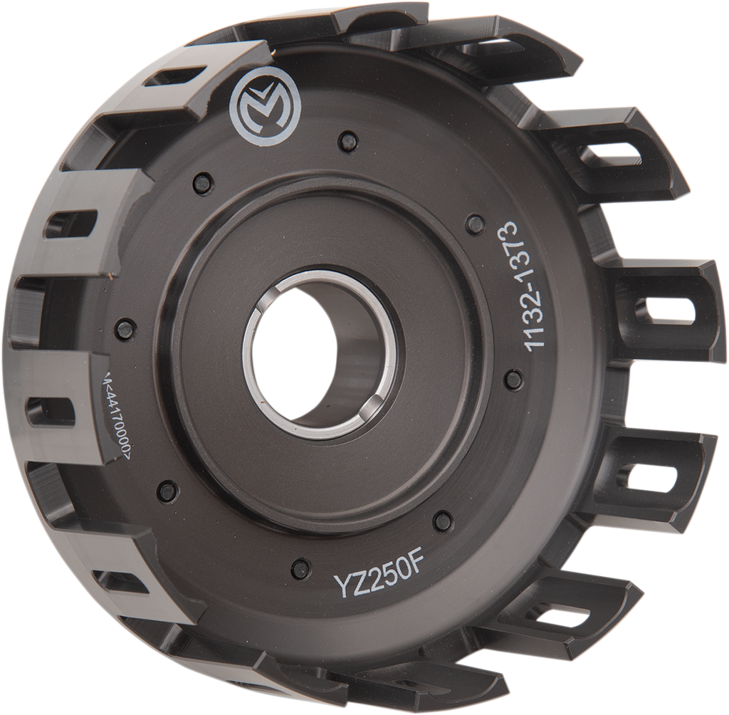 A black metal motorcycle clutch basket with multiple rectangular cutouts around the edge, a central circular hole, and white alphanumeric markings including YZ250F and 1132-1313 visible on the outer and inner surfaces.