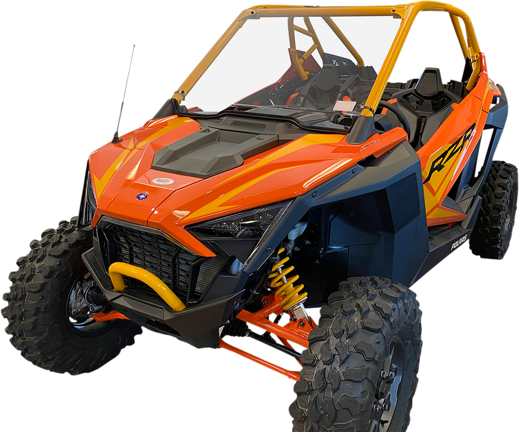 A bright orange and yellow off-road ATV with large, rugged tires, open cabin, two seats, and protective roll cage. Black accents on the body, yellow suspension springs visible, and an aggressive, angular front design. The vehicle sits on a white backgroun