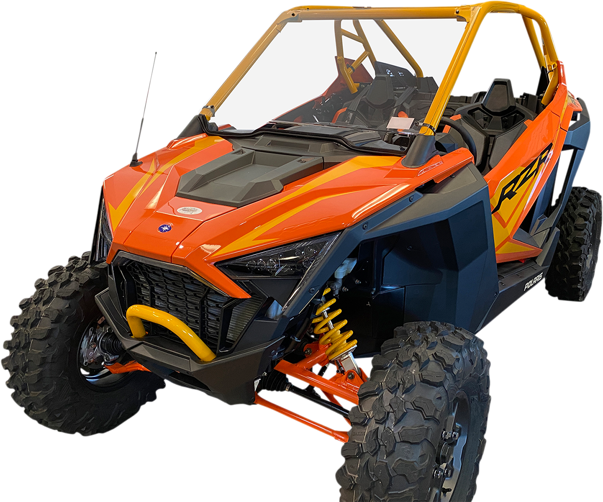 A bright orange and yellow off-road ATV with large, rugged tires, open cabin, two seats, and protective roll cage. Black accents on the body, yellow suspension springs visible, and an aggressive, angular front design. The vehicle sits on a white backgroun