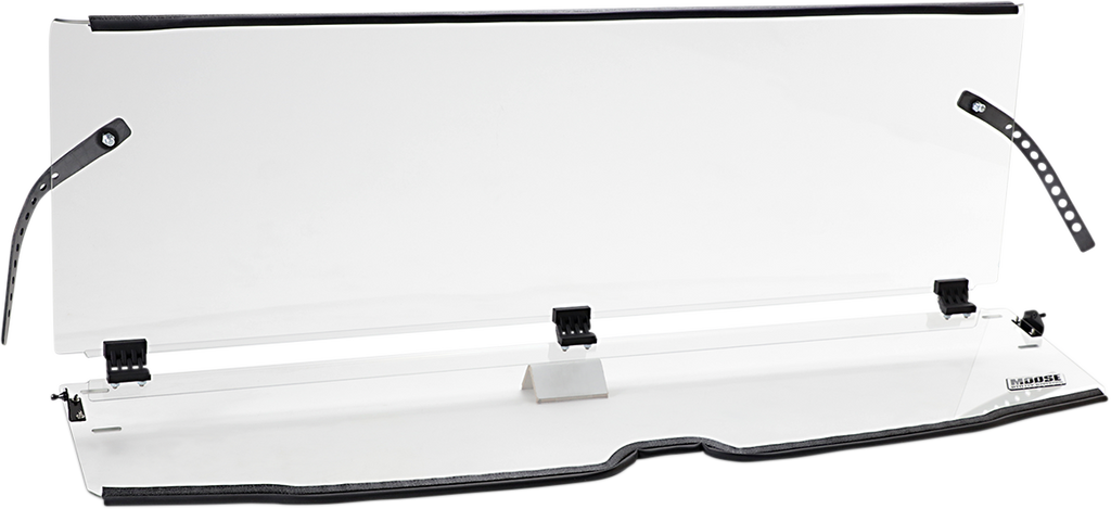 A clear acrylic sneeze guard with black adjustable mounting straps and clamps, slightly angled and supported by a central stand. The guard has a narrow base with a logo on the right side and is designed for countertop protection, likely for use in custome