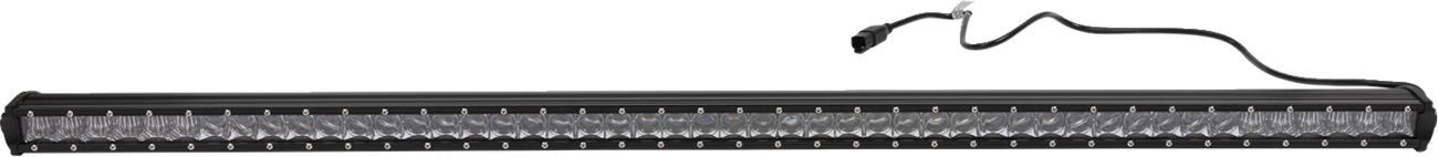 A long, rectangular LED light bar with a black frame and a clear lens covering rows of small LED bulbs. A black power cable with a connector extends from the top right corner of the light bar. The background is plain white.