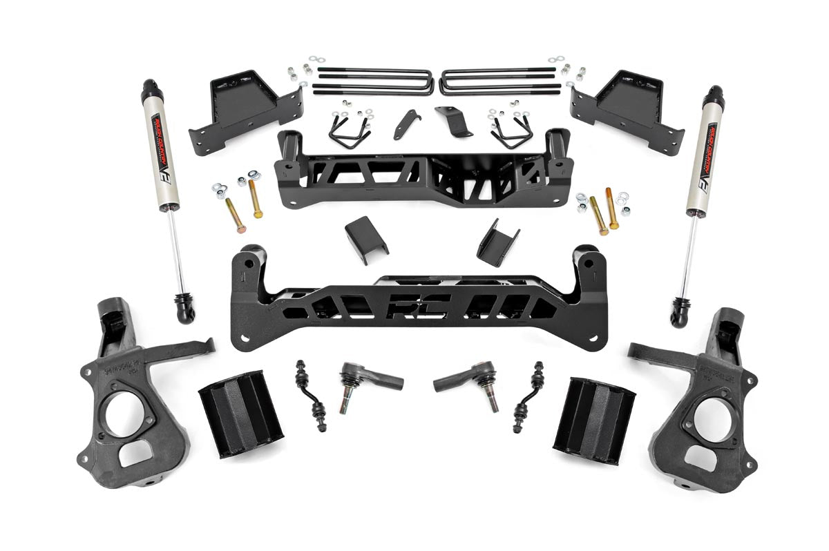 The 7 Inch Lift Kit | Alum/Stamp Steel | RR V2 for Chevy/GMC 1500 (14-18) includes two large black crossmembers, shock absorbers, steering knuckles, spacers, brackets, bolts, and hardware displayed on a white background.