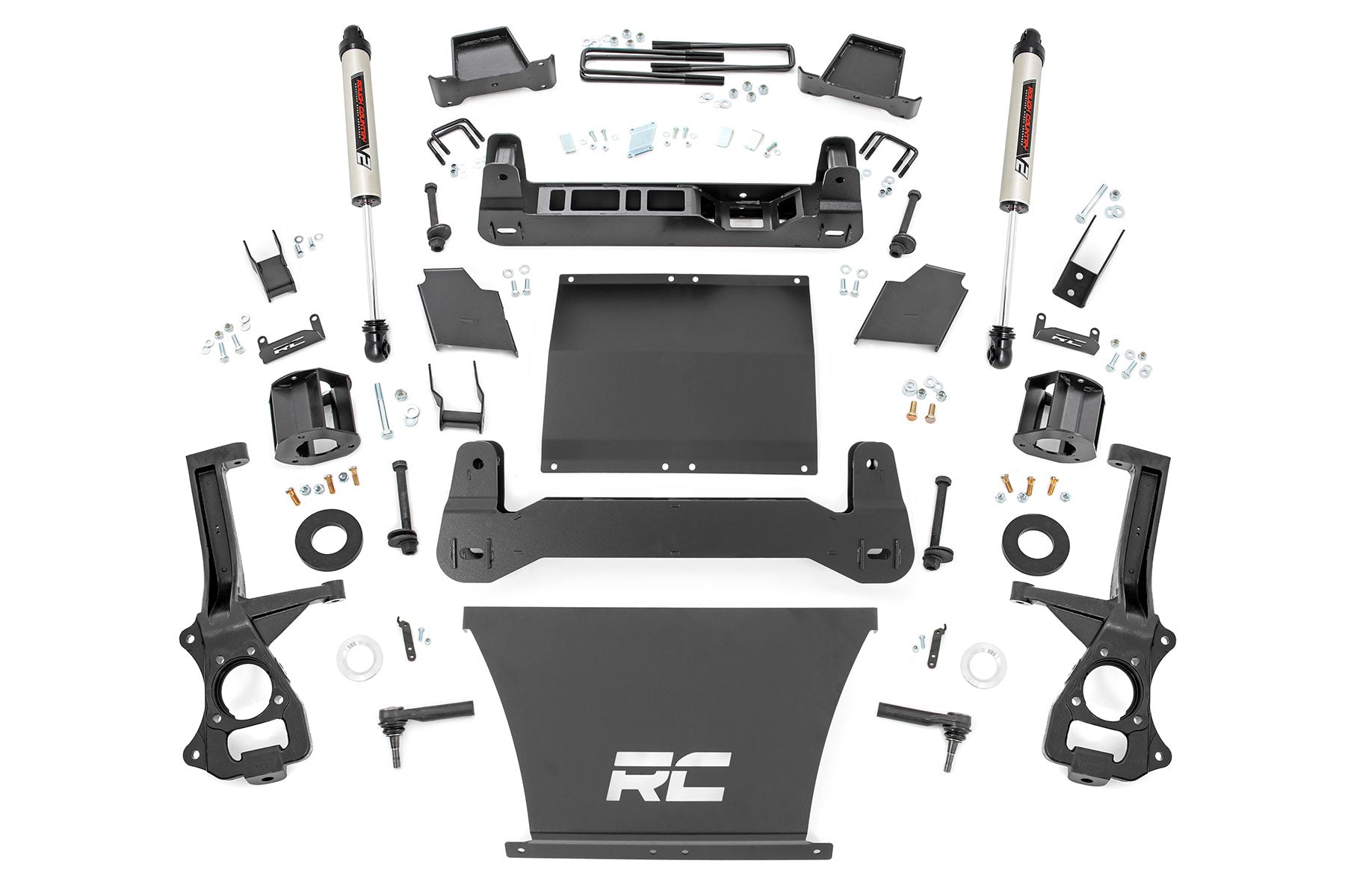 The 6 Inch Lift Kit | V2 for GMC Sierra 1500 (2019-2023) includes black metal suspension lift parts, custom brackets, bolts, spacers, two large RC-logo plates, and silver Rough Country V2 shock absorbers—everything you need to upgrade.