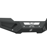 The 2015-2019 GMC 2500 Spartan Front Bumper by Road Armor features a textured black, angular design with geometric lines, cutouts, reinforced corners, a stylized X and circular logo—offering rugged protection with sharp edges and mounting points.