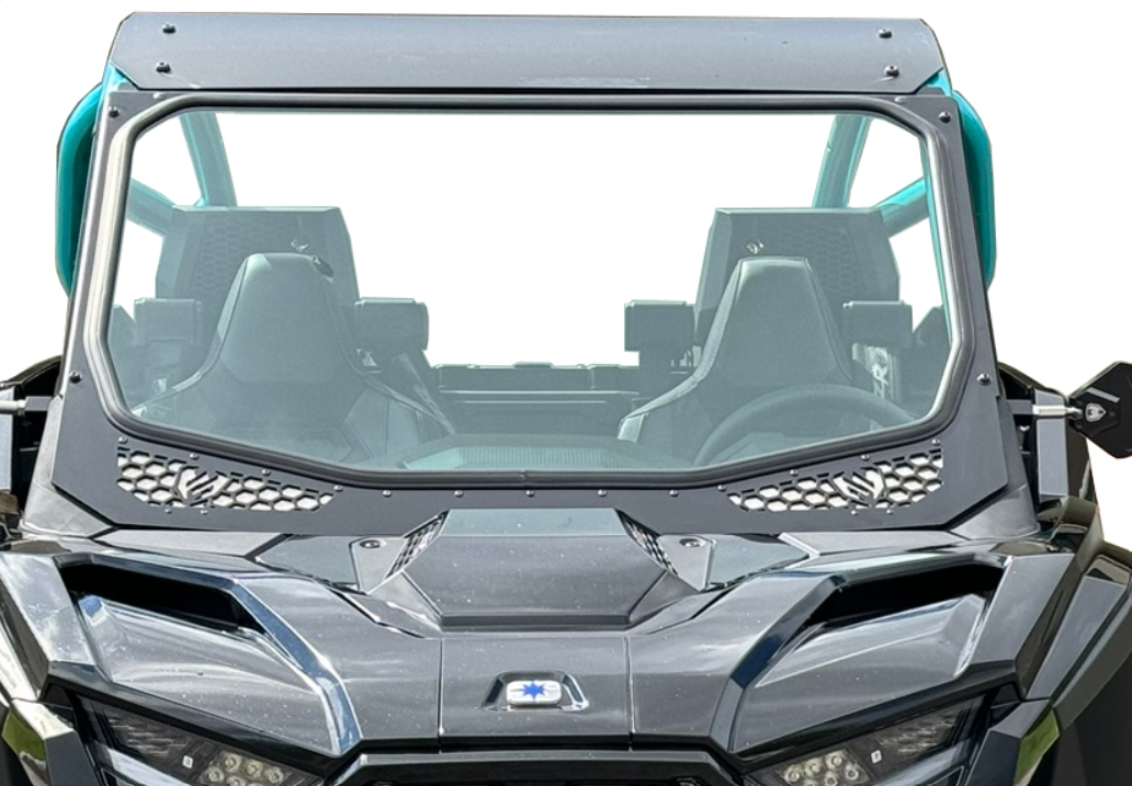 A close-up of the Glass Windshield for 2025+ RZR Pro R, S, XP, highlighting the angular metallic gray panels with teal accents and two empty black bucket seats against a plain white background.