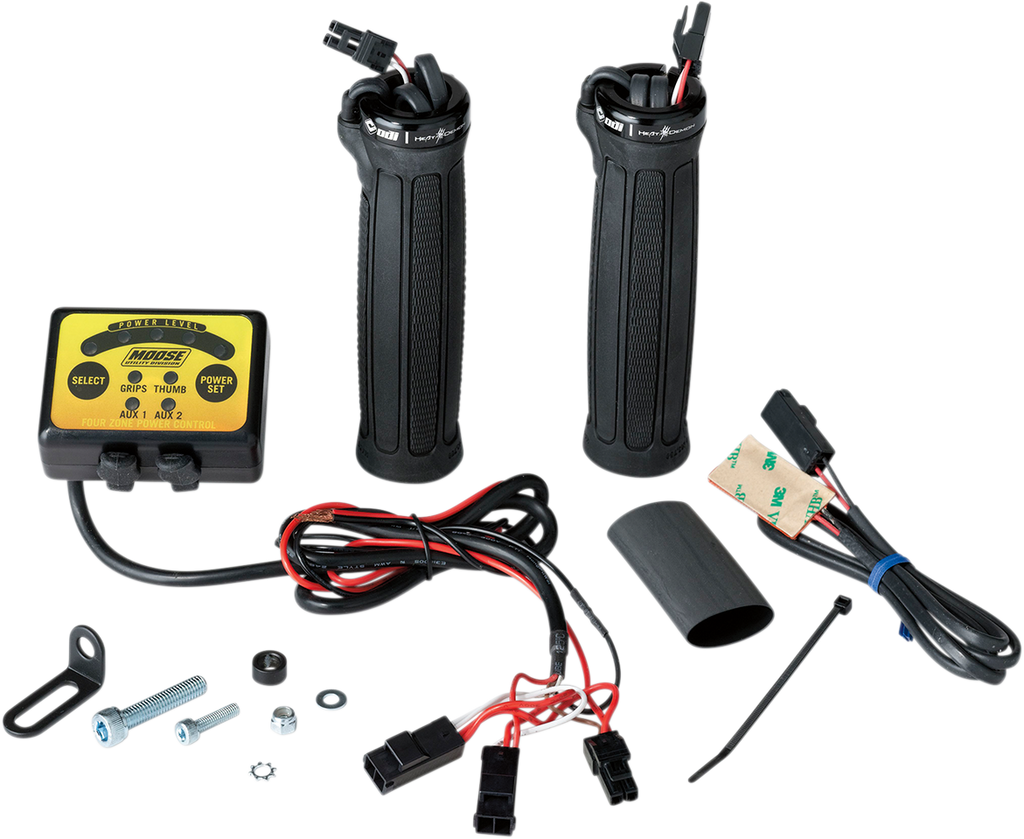 A motorcycle heated grip kit is shown, including two black rubber handlebar grips, a yellow-labeled control unit with buttons, various wires and connectors, mounting hardware, adhesive pad, zip tie, and a black cylindrical sleeve—all parts laid out on a w
