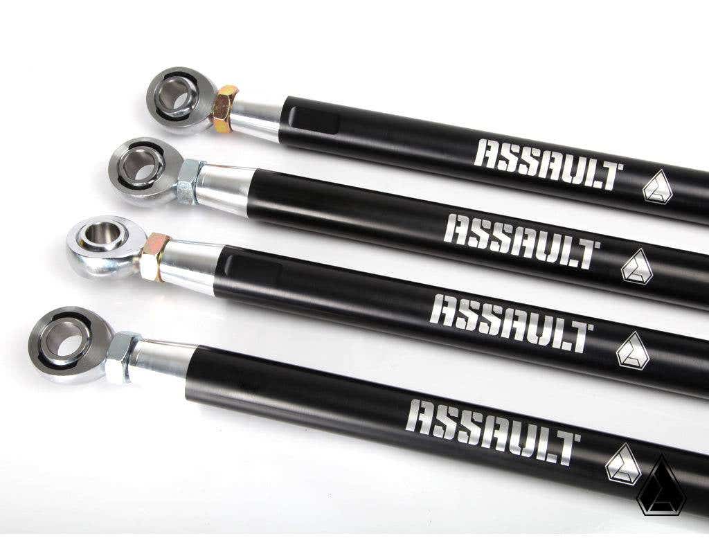 Four black Assault Industries HD Barrel Radius Rods for Honda Talon, with silver threaded ends, spherical bearings, bold white ASSAULT branding, and a geometric logo, are arranged diagonally on a white surface.