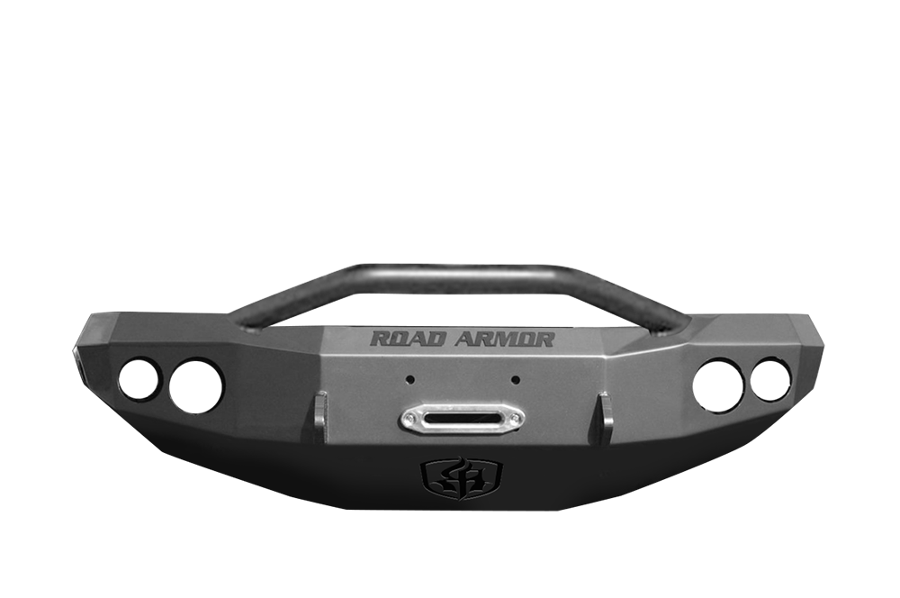 A textured black 2000-2007 GMC 2500 Stealth Front Winch Bumper with Pre-Runner Guard, central winch cutout, circular side holes, raised protective bar, and the “ROAD ARMOR” logo above a shield emblem; fits Warn M12000/Smittybilt XRC.