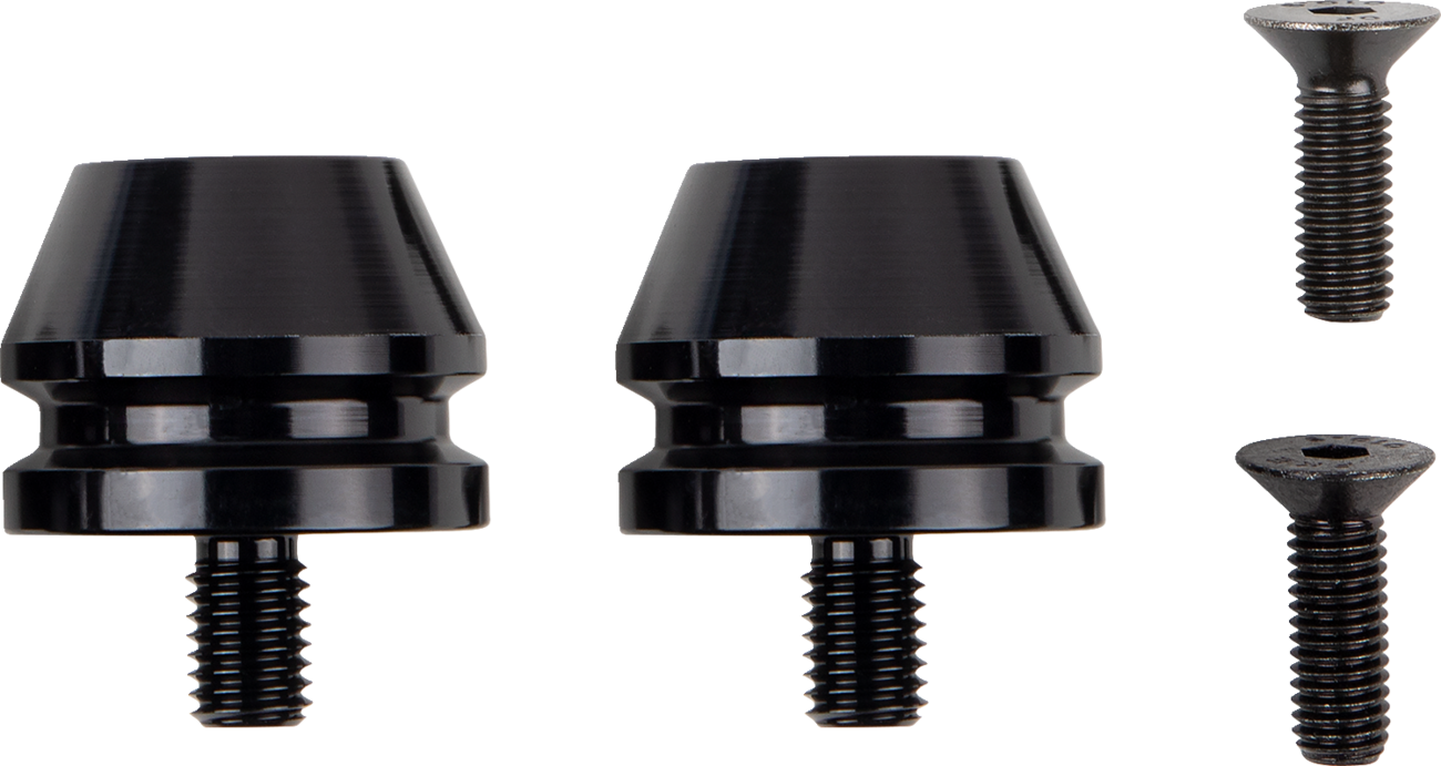 Two black, cylindrical metal components with threaded bolts are shown side by side. To the right, two black, flathead screws are placed vertically. The items are arranged against a plain, light background.