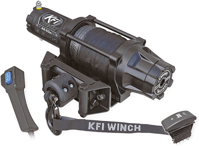 A 5000 Wide Assault Series Winch by KFI, featuring a black finish with a blue synthetic rope on its drum, is shown attached to a mounting plate. Also pictured are a remote control with a blue button and connector, plus “KFI Winch” branding.