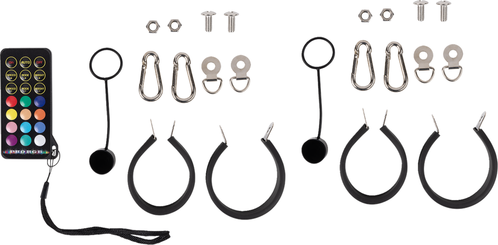 A set of LED rock light accessories, including a remote control, four black rubber mounting rings, screws, nuts, washers, metal brackets, carabiner clips, and wiring hardware, all laid out neatly on a white background.