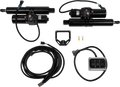 Two black linear actuators with cables, a coiled wiring harness, a metal mounting bracket, two ring terminals, and a rectangular control switch box with two switches are arranged neatly on a white background.