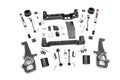 The 4 Inch Lift Kit | V2 for Ram 1500 4WD (2012-2018 & Classic) is displayed on a white background, featuring crossmembers, shock absorbers, spindles, spacers, brackets, bolts, washers, and hardware neatly organized in rows.