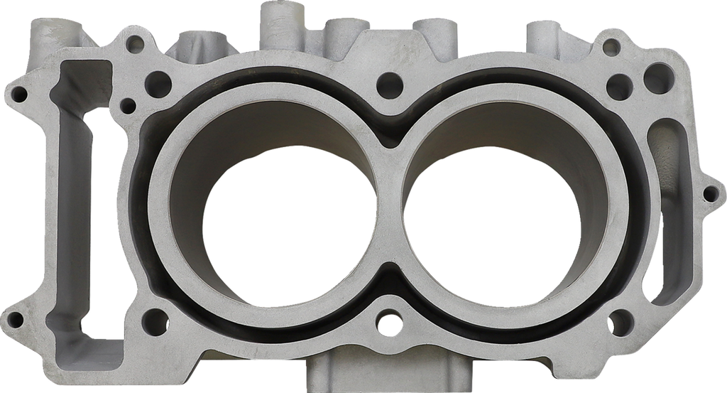 A close-up view of a silver metal engine block, showing two large, circular cylinder bores side by side. The surface is smooth with machined edges, multiple bolt holes, and openings for fluid and airflow channels surrounding the cylinders.