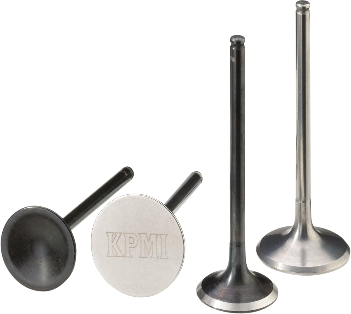 Four metal engine valves are shown upright on a white background. The left two are darker with flat, round heads (one engraved with KPMI), while the right two are shinier, with reflective surfaces and slightly flared bases.