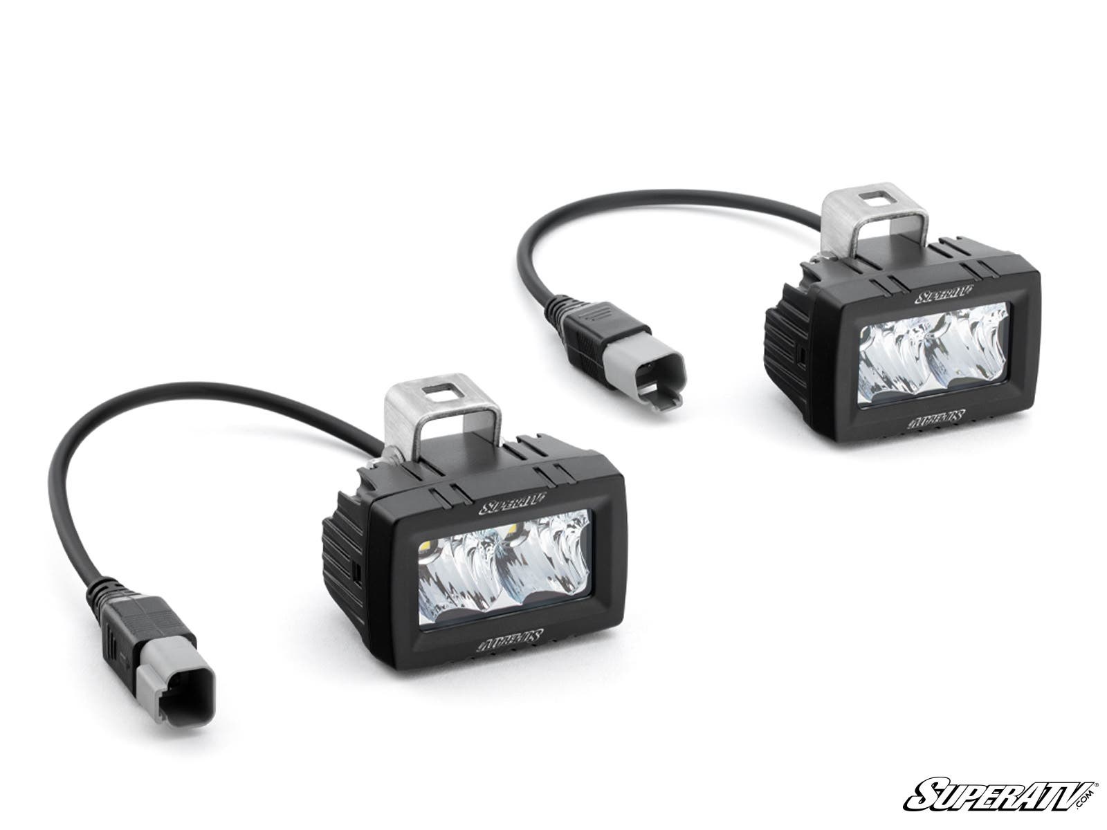 Two 3 x 1.5 Single-Row LED Cube Lights, each with metal mounting brackets and cables ending in gray connectors, are shown on a white background. SuperATV appears in the bottom right corner.