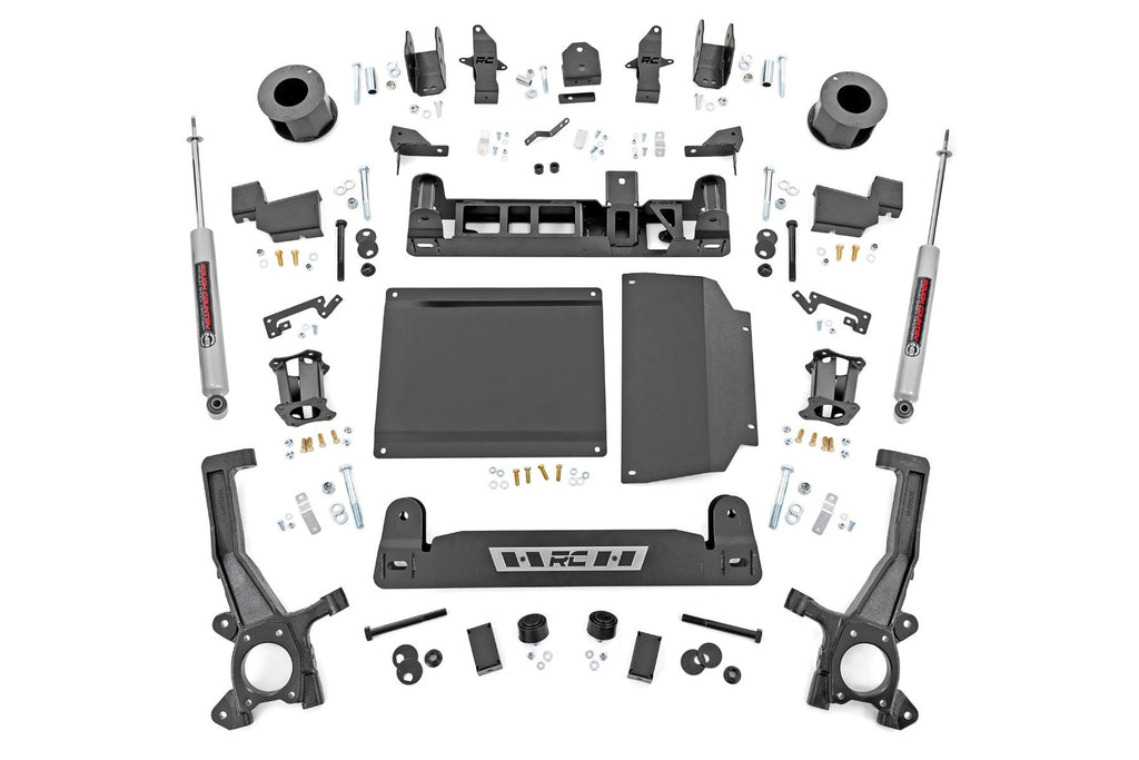 The 6 Inch Lift Kit | N3 for Toyota Tundra 2WD/4WD (2022-2025) features black metal and plastic suspension components, brackets, plates, spacers, bolts, and two gray shock absorbers arranged symmetrically on a white background.