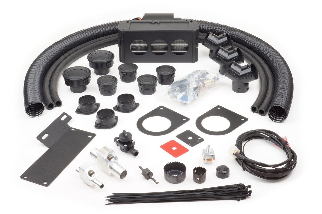 The Polaris Ranger XP900/900 (2013-2020) Ice Crusher Cab Heater kit includes black hoses, plastic vents, metal brackets, circular fittings, mounting hardware, zip ties, cables, connectors, gaskets, and a rectangular blower unit arranged on a white backgro