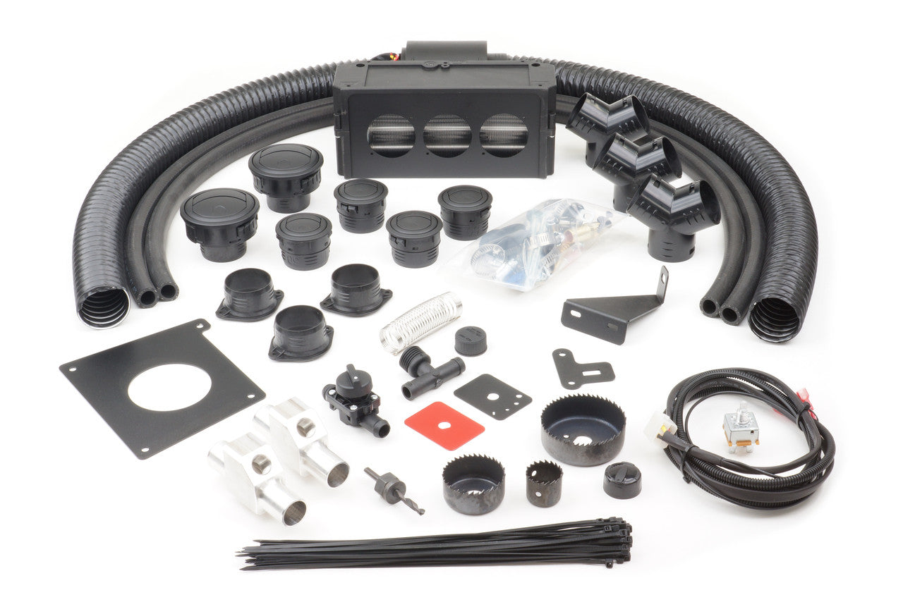 The Polaris Ranger 800 Full Size (2009-2014) Ice Crusher Cab Heater kit is displayed with hoses, vents, clamps, wiring, brackets, grommets, saw bits, a control switch, plastic mounts, zip ties, and mounting hardware on a white background.