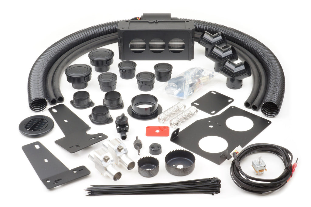 A set of components for the Polaris Ranger Midsize ETX (2015-2017) Ice Crusher Cab Heater, including hoses, vents, brackets, clamps, wires, zip ties, fittings, screws, grommets, plates, saw blades, springs, and connectors on a white surface.