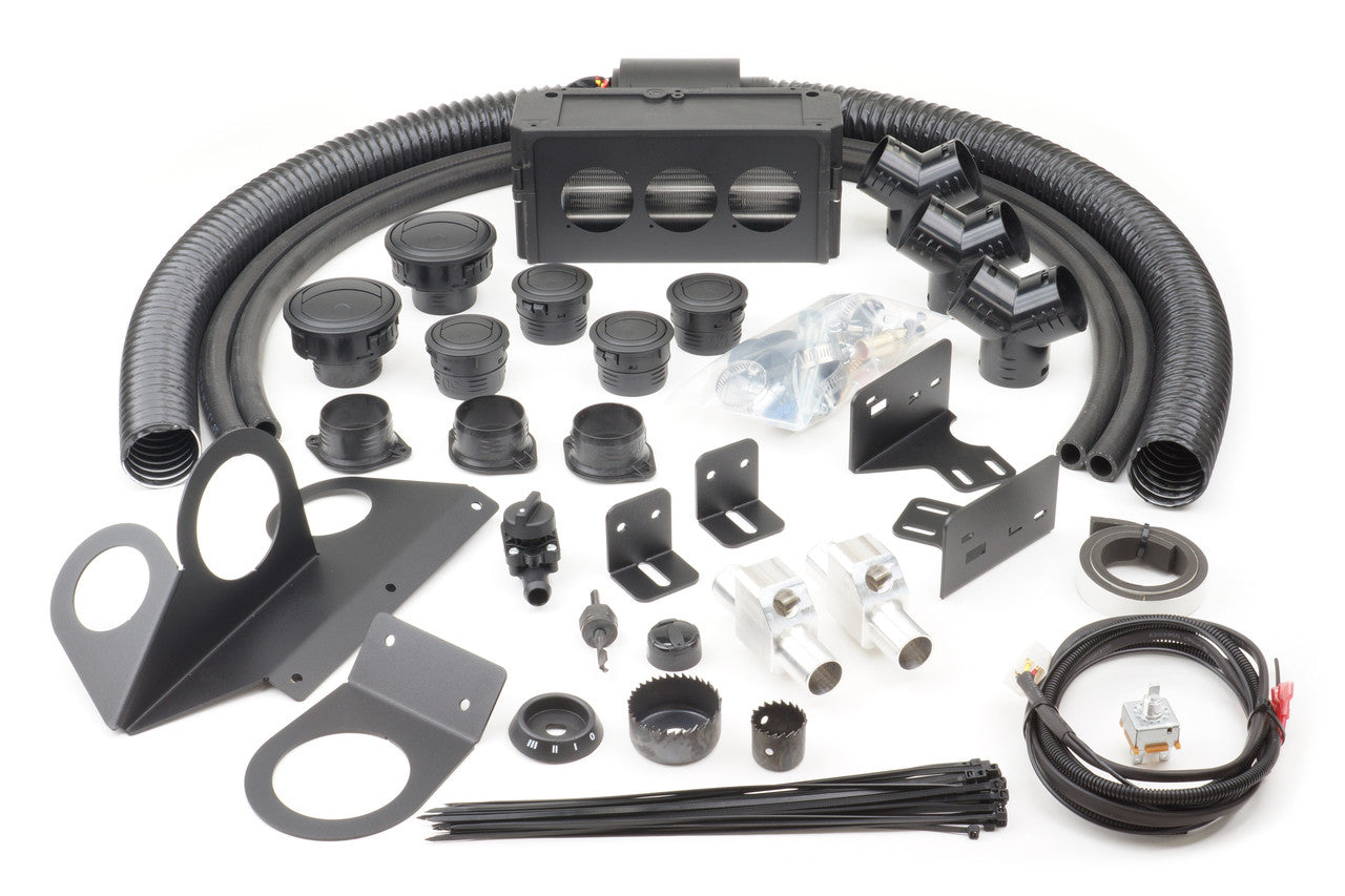 The Polaris RZR 1000 (2014-2018) & RZR 1000S (2019-2021) Ice Crusher Cab Heater kit includes black hoses, air vents, brackets, connectors, plastic ties, metal fittings, screws, and wires arranged on a white background.