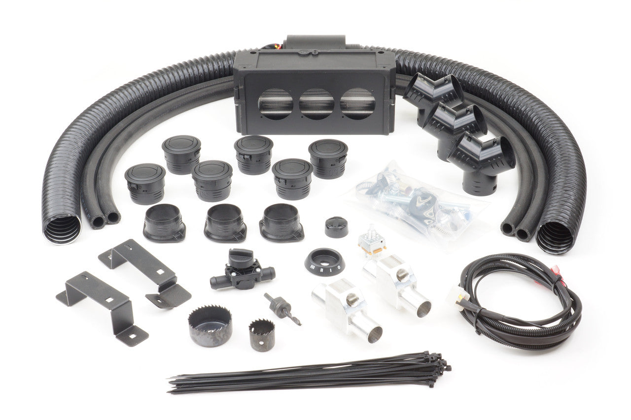 The Kawasaki Mule Pro FXT/FX/FXD Under Hood (2015-2021) Ice Crusher Cab Heater kit includes black hoses, a rectangular heater unit, vent covers, brackets, wiring, switches, hose clamps, connectors, cutting tool, cable ties, and hardware.