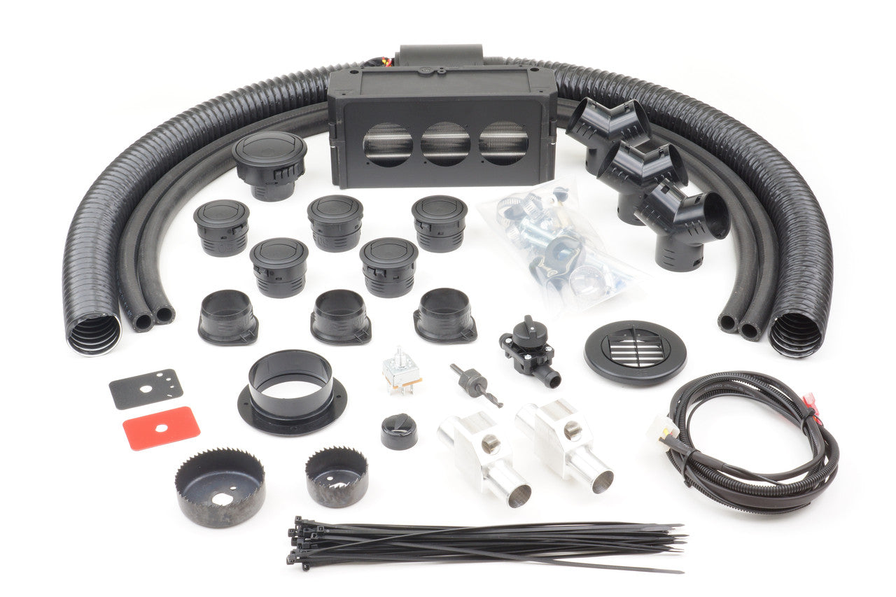 The CFMoto UForce 500/800 (2015-2021) Ice Crusher Cab Heater kit is shown on a white background with black hoses, vents, connectors, metal parts, wiring, zip ties, screws, and assorted fittings neatly arranged in rows.