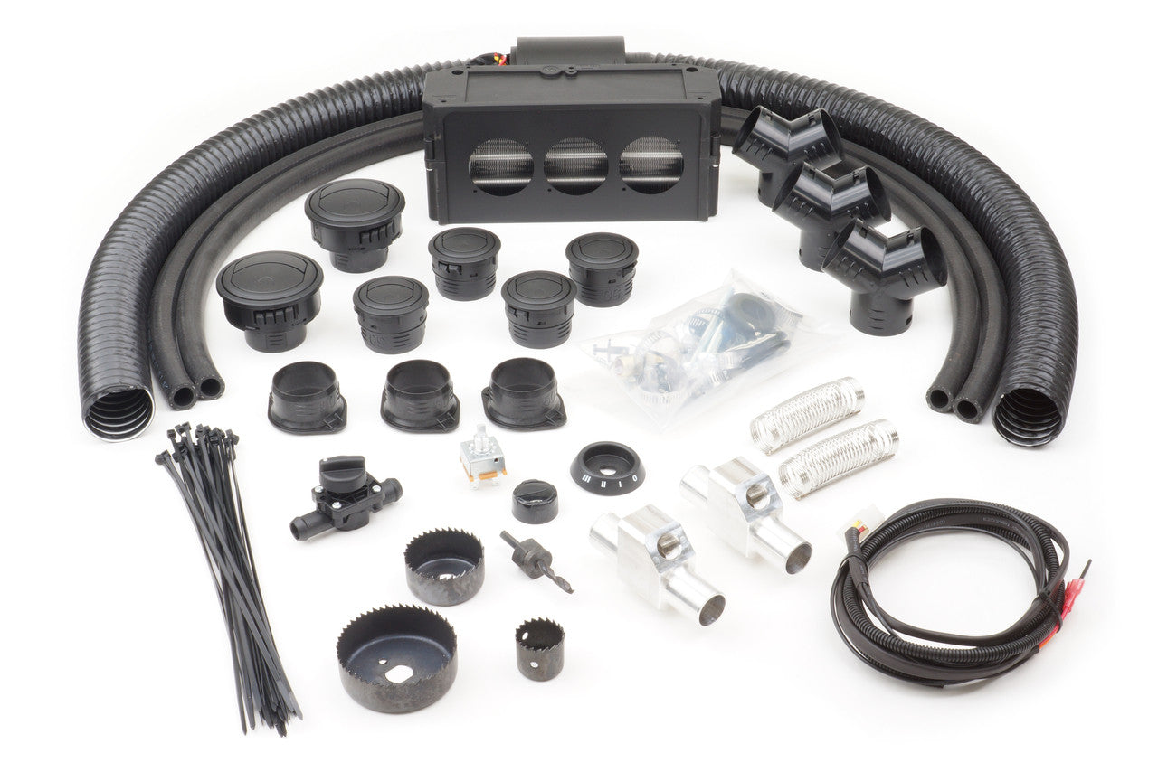 The John Deere Gator 590 All Submodels (2016-2021) Ice Crusher Cab Heater kit includes black hoses, connectors, vents, zip ties, clamps, wiring, screws, a hole saw, and a rectangular blower unit arranged on a white background.