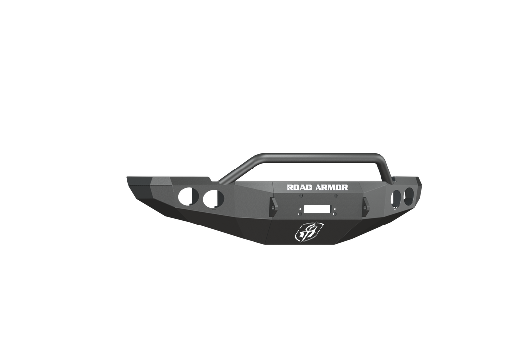 A 2010-2018 Ram 2500 Stealth Front Winch Bumper Pre-Runner Guard in texture black, featuring angular edges, round fog light cutouts, central grill guard bar, white “ROAD ARMOR” text, shield logo under the winch mount—shown on white background.