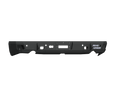 The 2009-2018 Ram 1500 Stealth Rear Winch Bumper (Texture Black, Warn M8000 Only) features a matte finish, angular edges, mounting holes, cutouts for lights or sensors, and a white ROAD ARMOR logo—designed for rugged off-road protection.