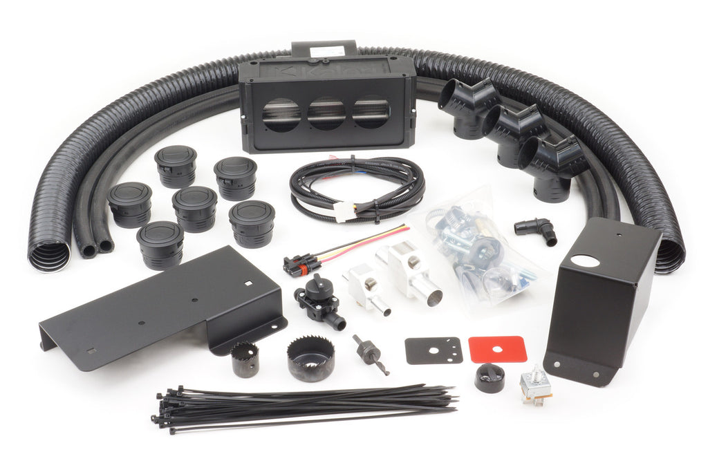 The Polaris RZR Pro XP | Pro R | Turbo R (2019-2024) Ice Crusher UTV Cab Heater with Defrost includes black flexible hoses, a rectangular vent box, assorted fittings, wiring harness, brackets, switches, zip ties, screws, and hardware.